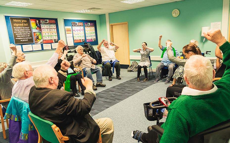 Student leads low mobility exercise class with elderly patients