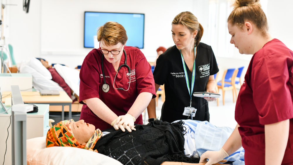 Marjon Nursing students using the life-like training dummies to practice resuscitation