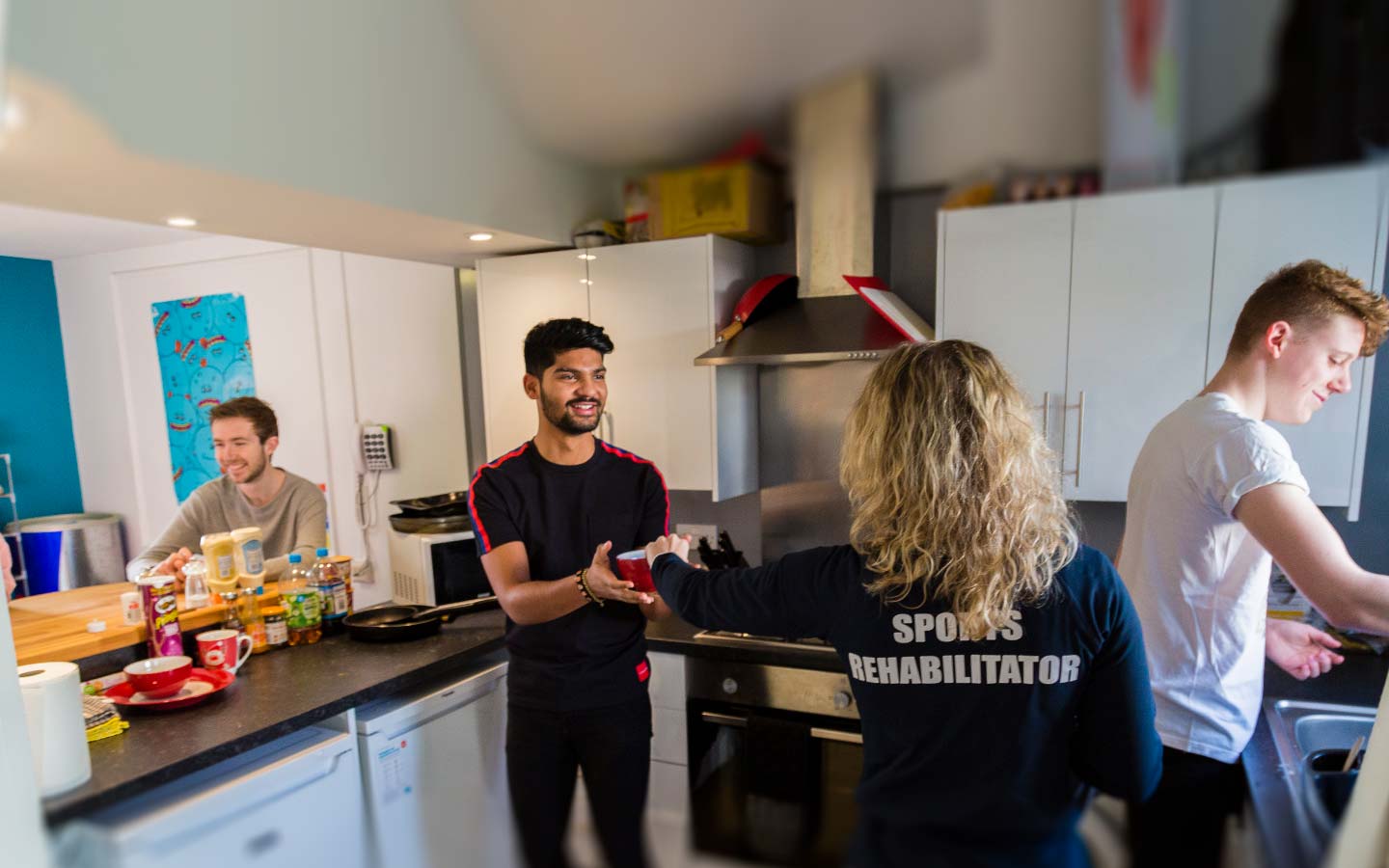 Students in a village kitchen