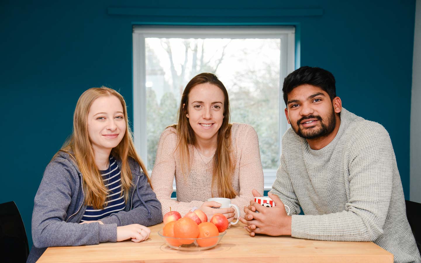 Three student friends sitting together