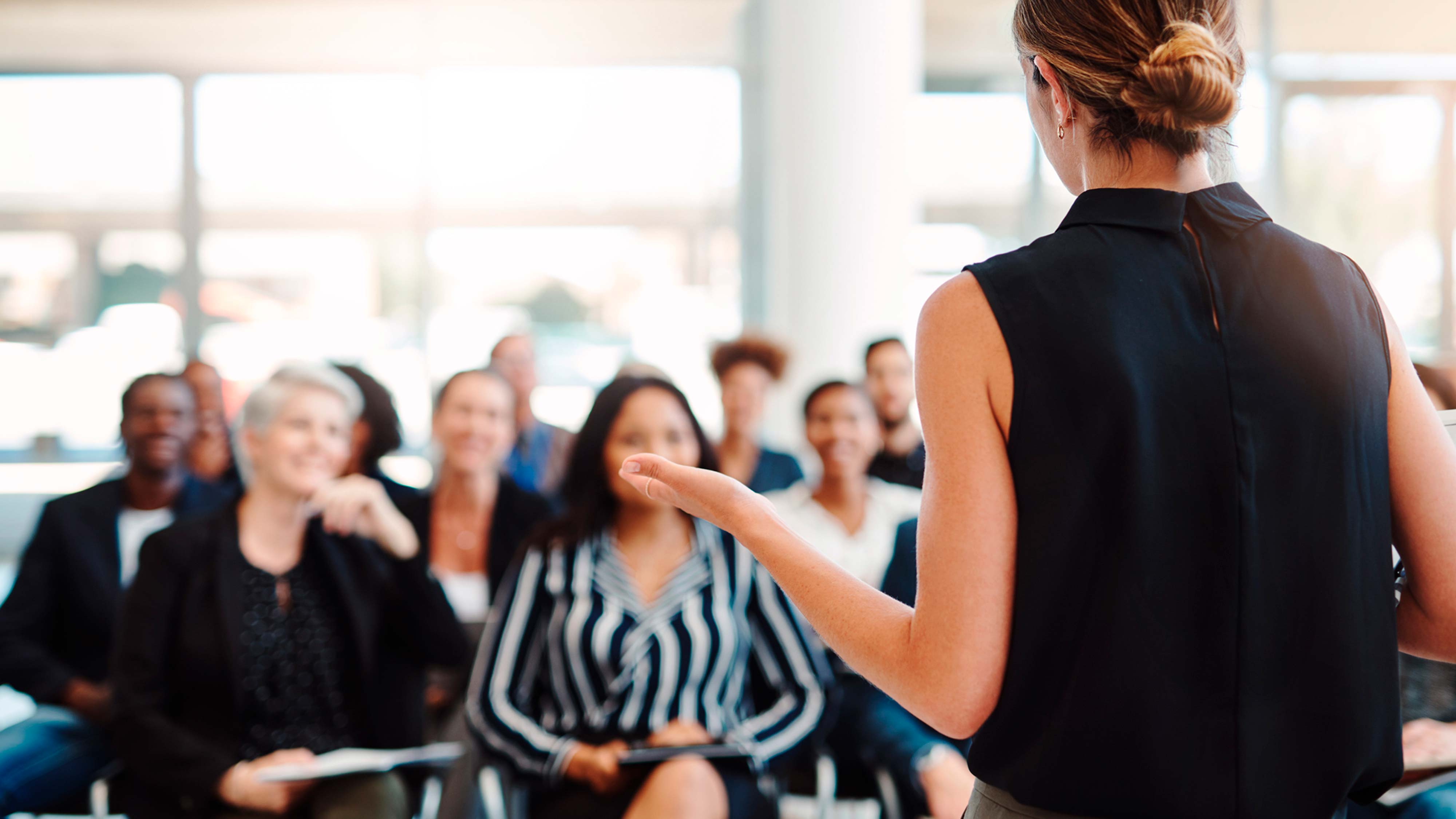 A woman speaking to an audience