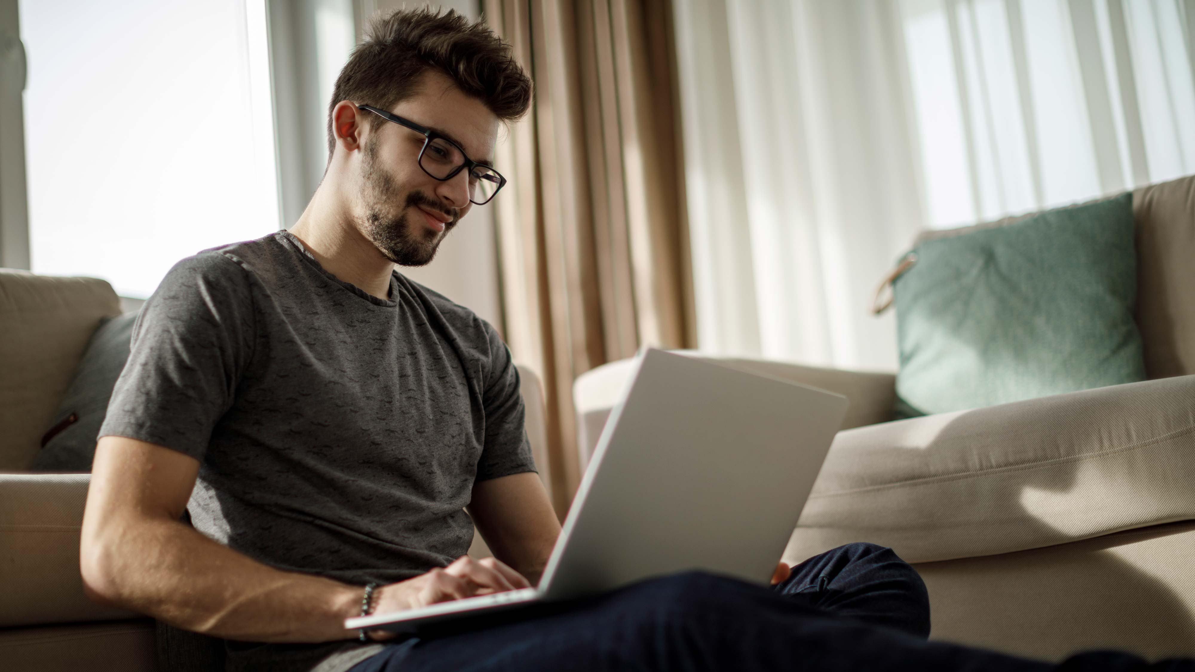 A man sat using a laptop