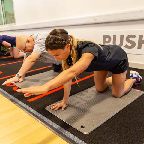 Student training a patient to use exercise as medicine