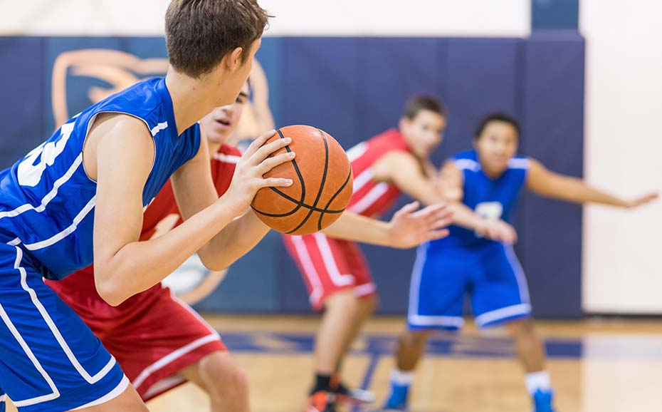 Basketball game played by young teenagers