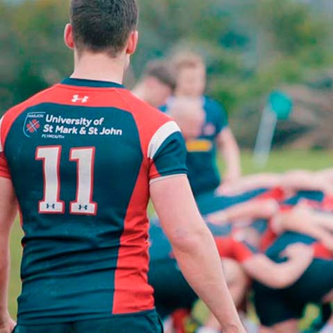 A Marjon rugby player waits outside the scrum