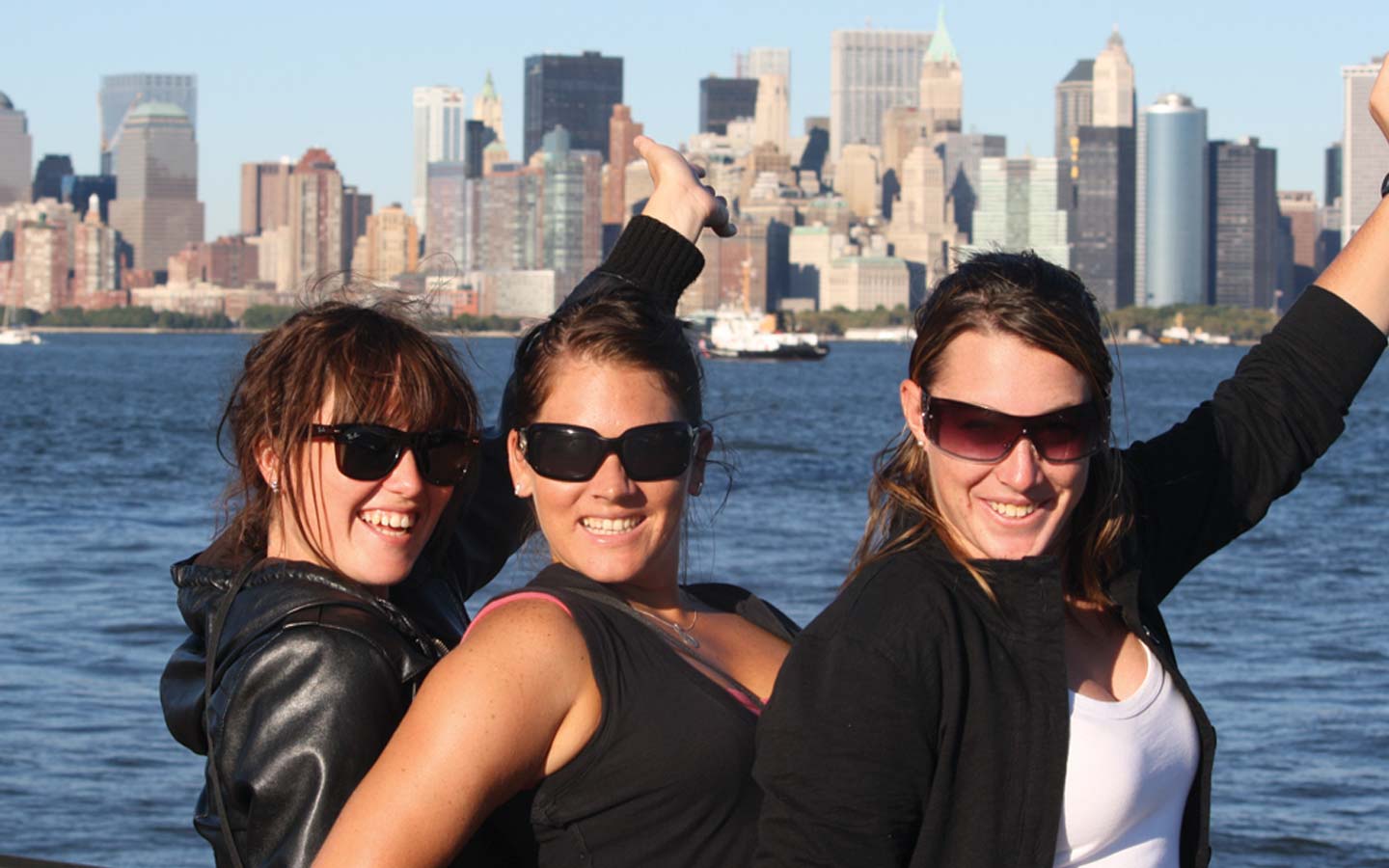 Students with the skyline of an American city in the background