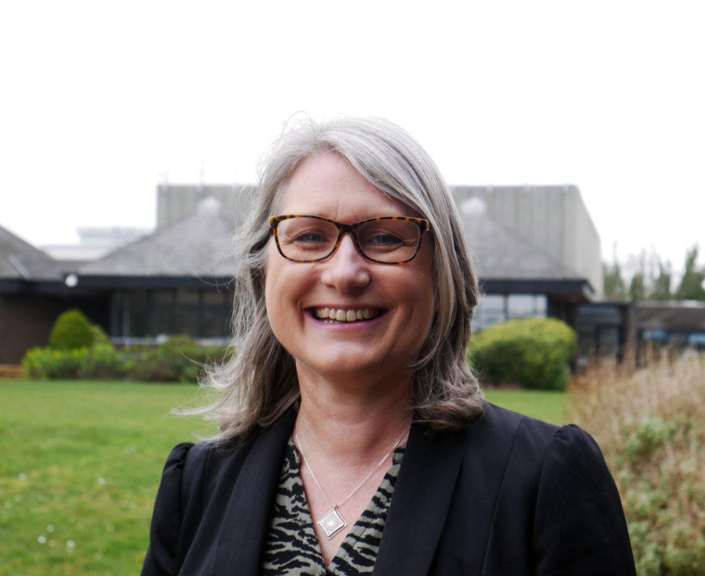 Claire Taylor, vice-chancellor of Plymouth Marjon University, standing in the quad