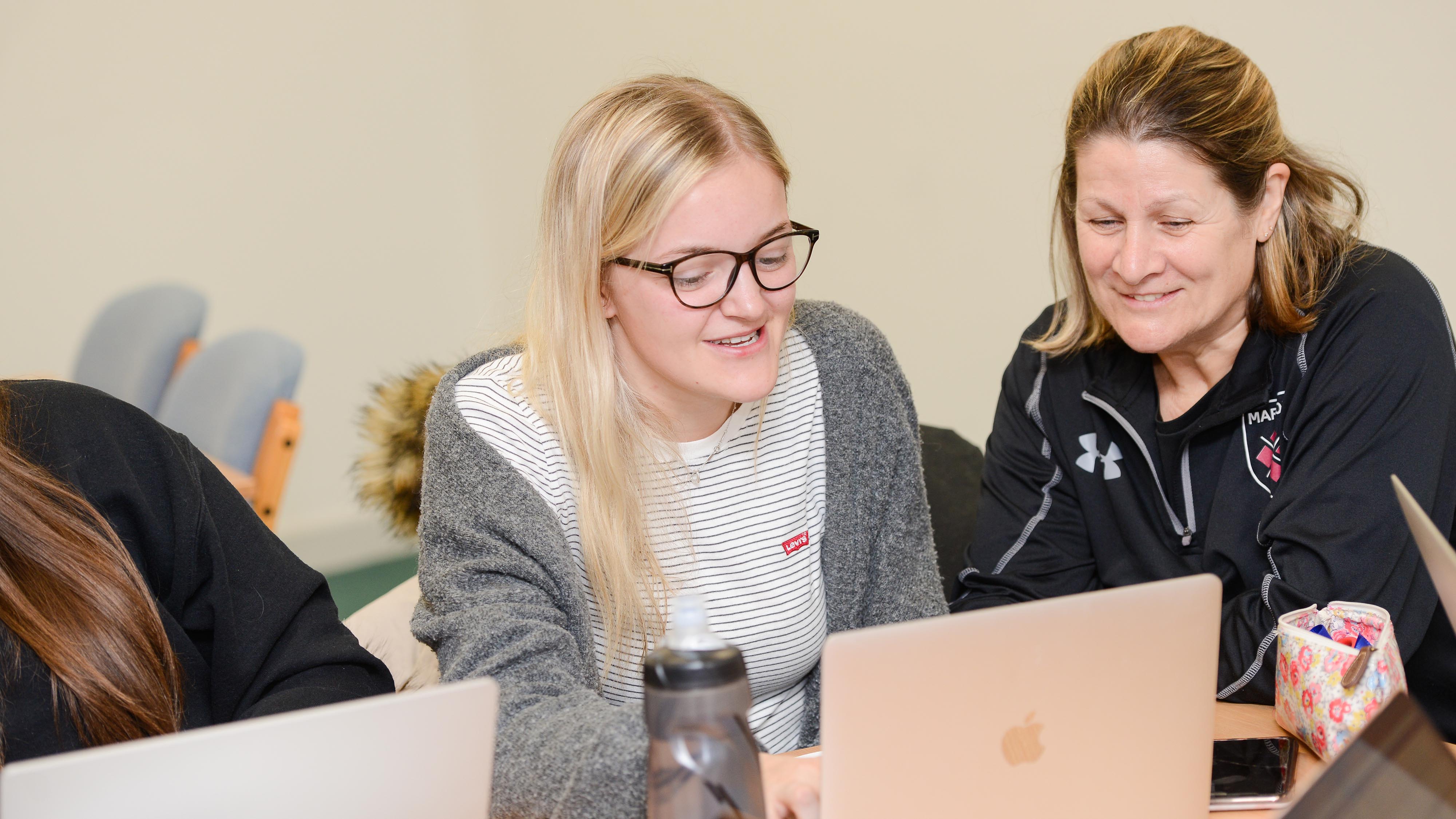 Lecturer works one-to-one with student