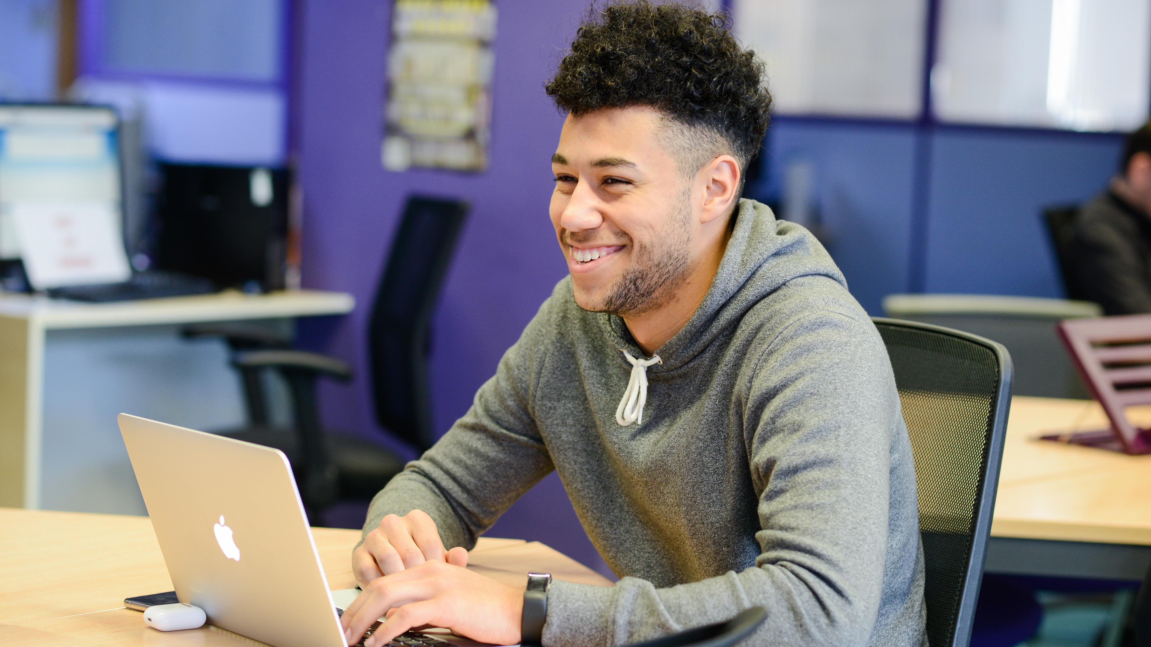 Student works on laptop
