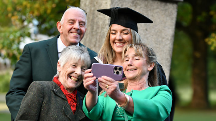 Parents and grandparents celebrating with graduate