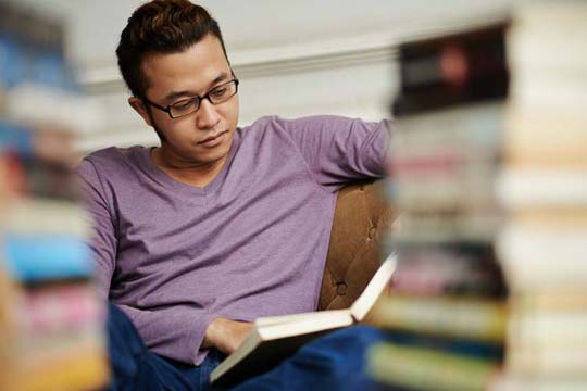 MREs student reading books for his research