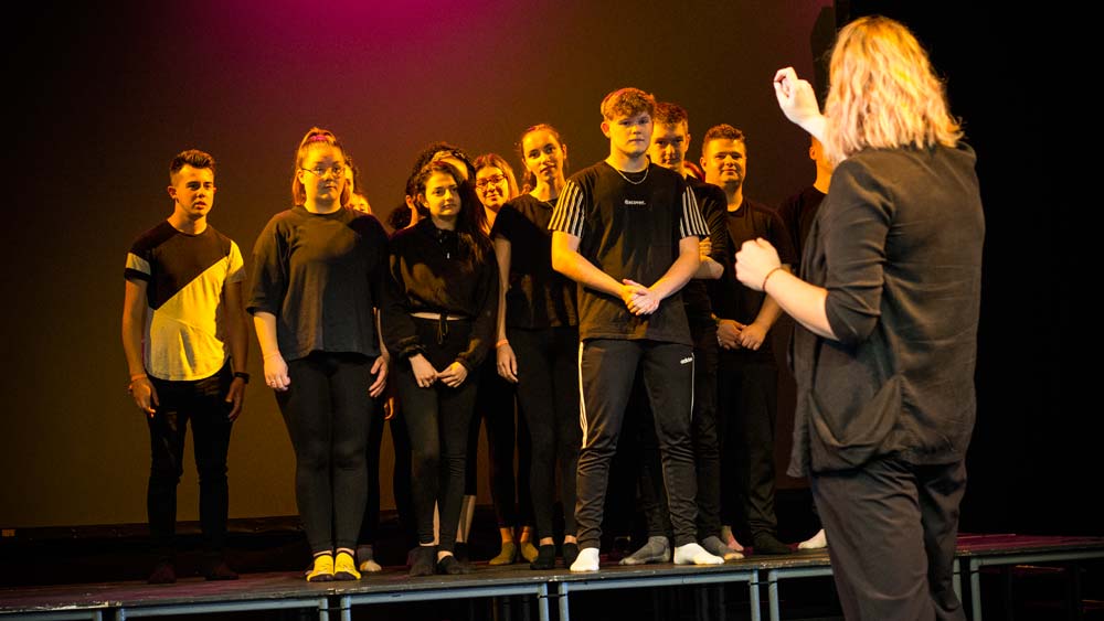 Students rehearsing a musical theatre number