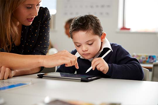 Teacher with young student