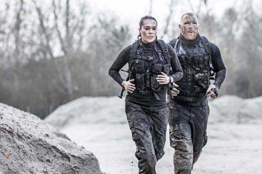 Two military personnel on a training run