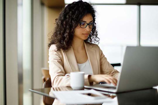 Professional educator does distance learning on her laptop