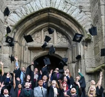 Students celebrating outside the church