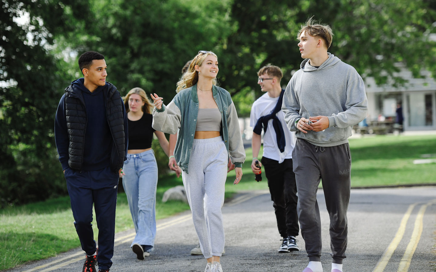 Students walking through campus chatting