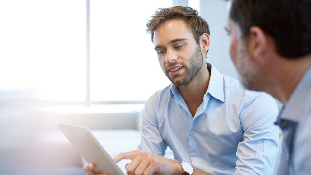 A young teacher talks to his mentor