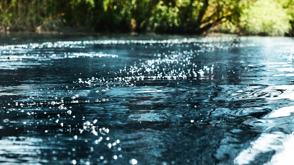 A sparkling blue river flows