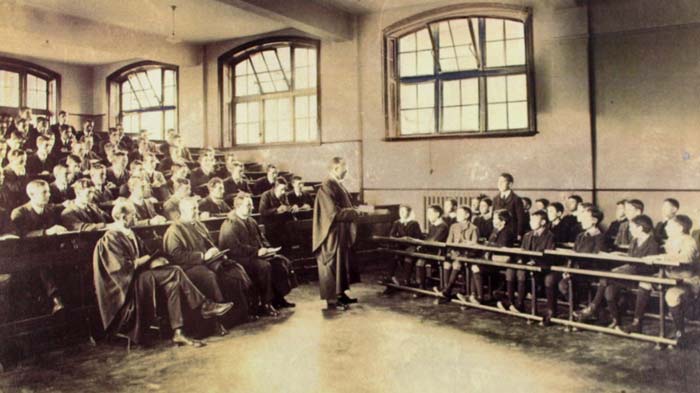 Students in gowns in a 1958 lecture