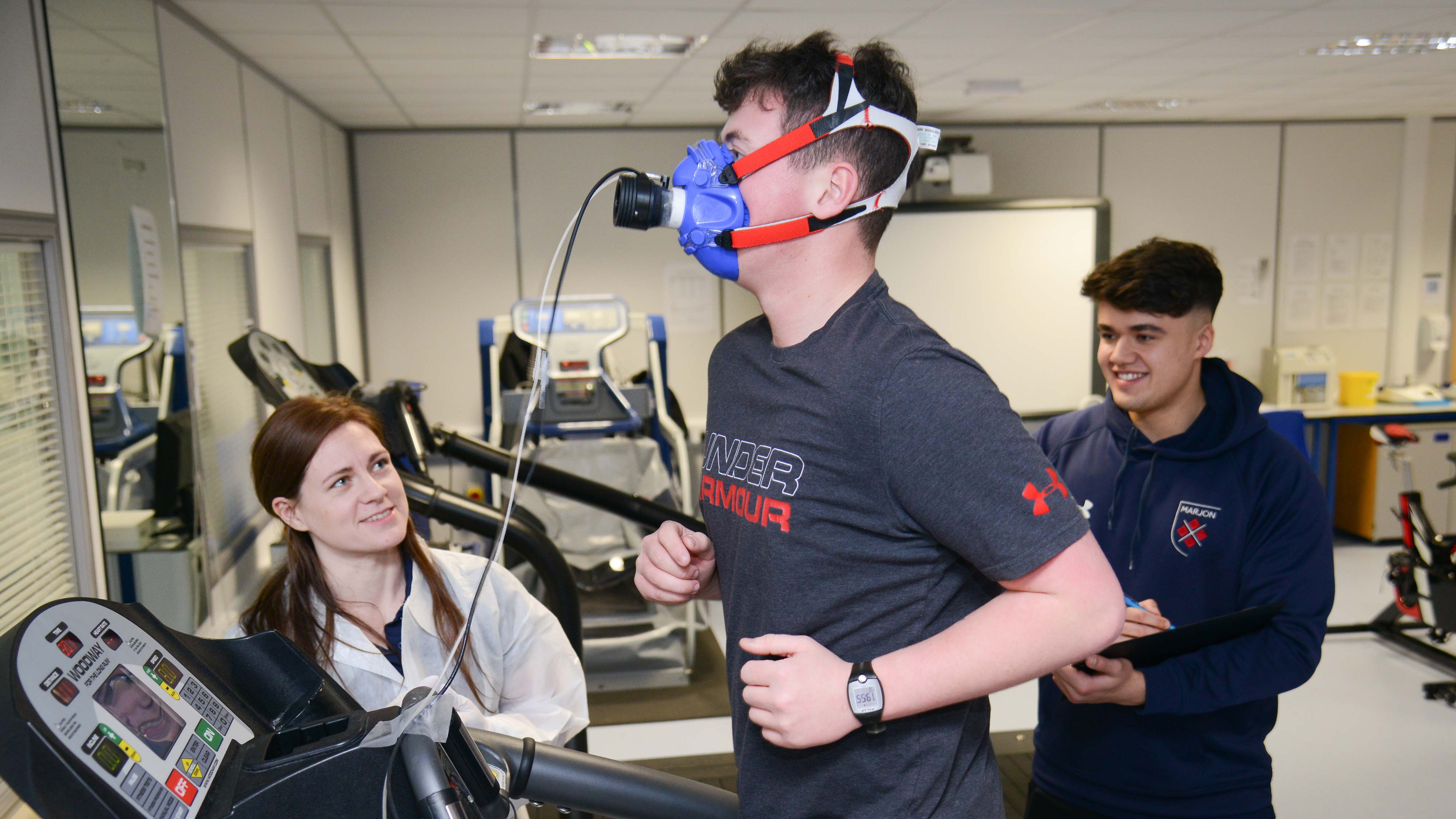 Capturing data as student runs in the sports science lab