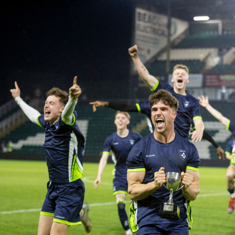 Student footballers celebrating a win