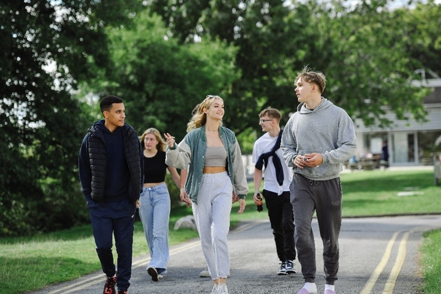 A group of students walking on Marjon's campus