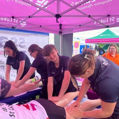 Marjon sports therapy students delivering therapy to runners