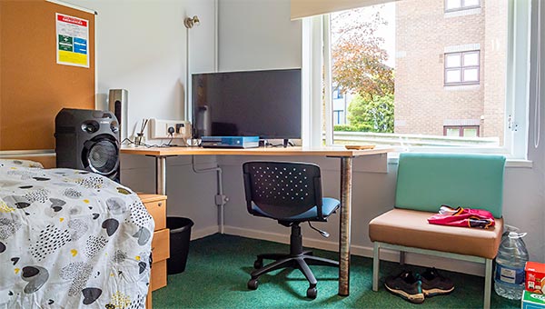 Study desk with office chair, easy chair and noticeboard
