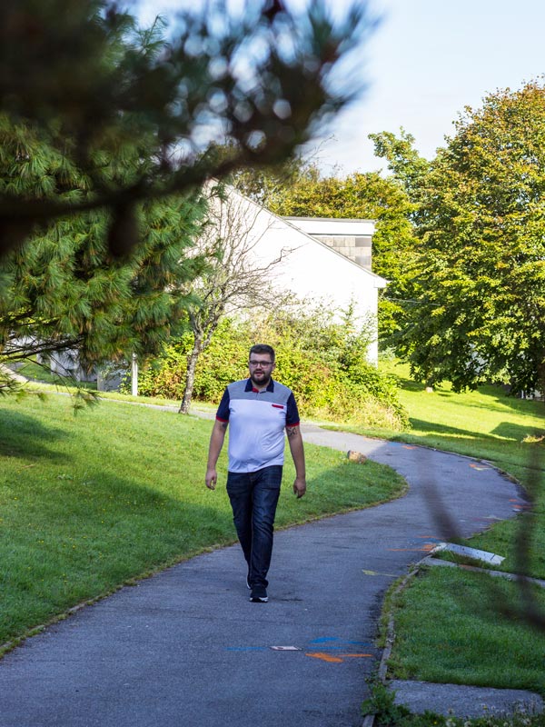 A student walks through the village