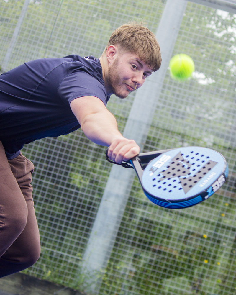 Student playing padel at our Sport & Health Centre