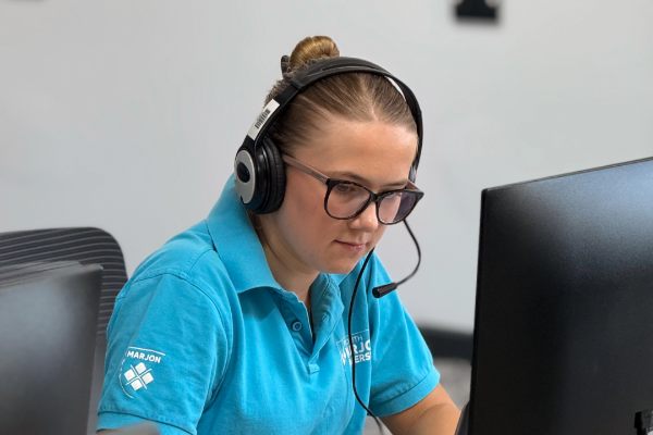 female student with a headset on making phone calls