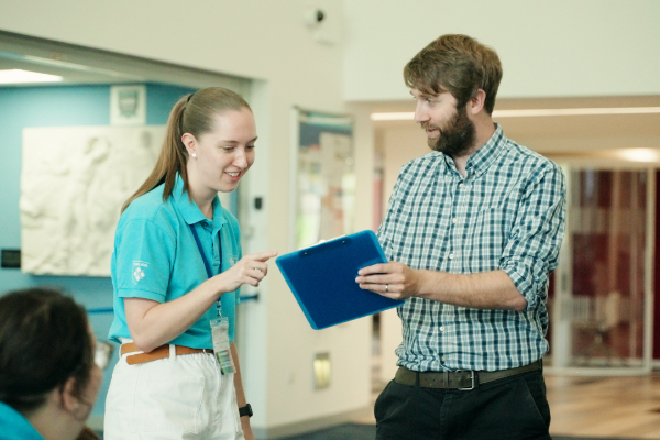 Student ambassador getting brief from member of Marjon staff