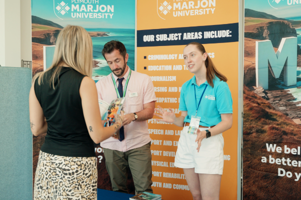Student ambassador talking to someone about Marjon