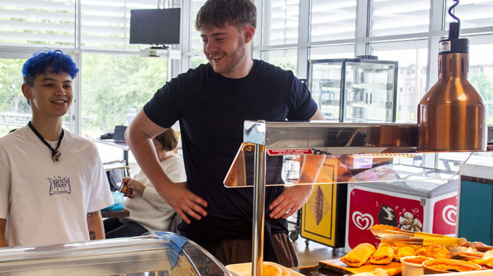 Students being served food at Grandstand Cafe