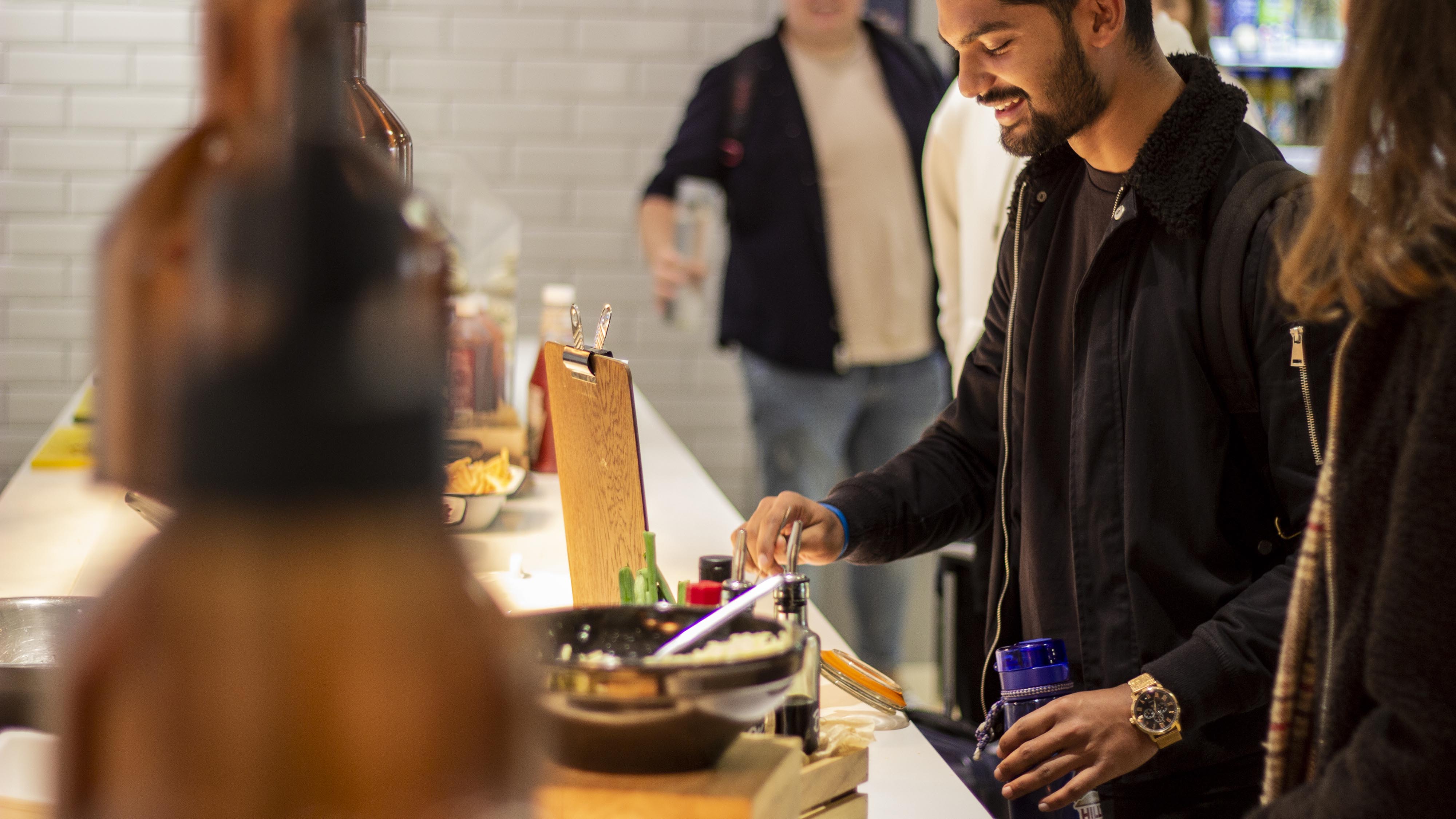 Student picking a meal in the hub restaurant