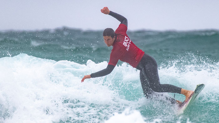 Sport Scholar surfing on local beach