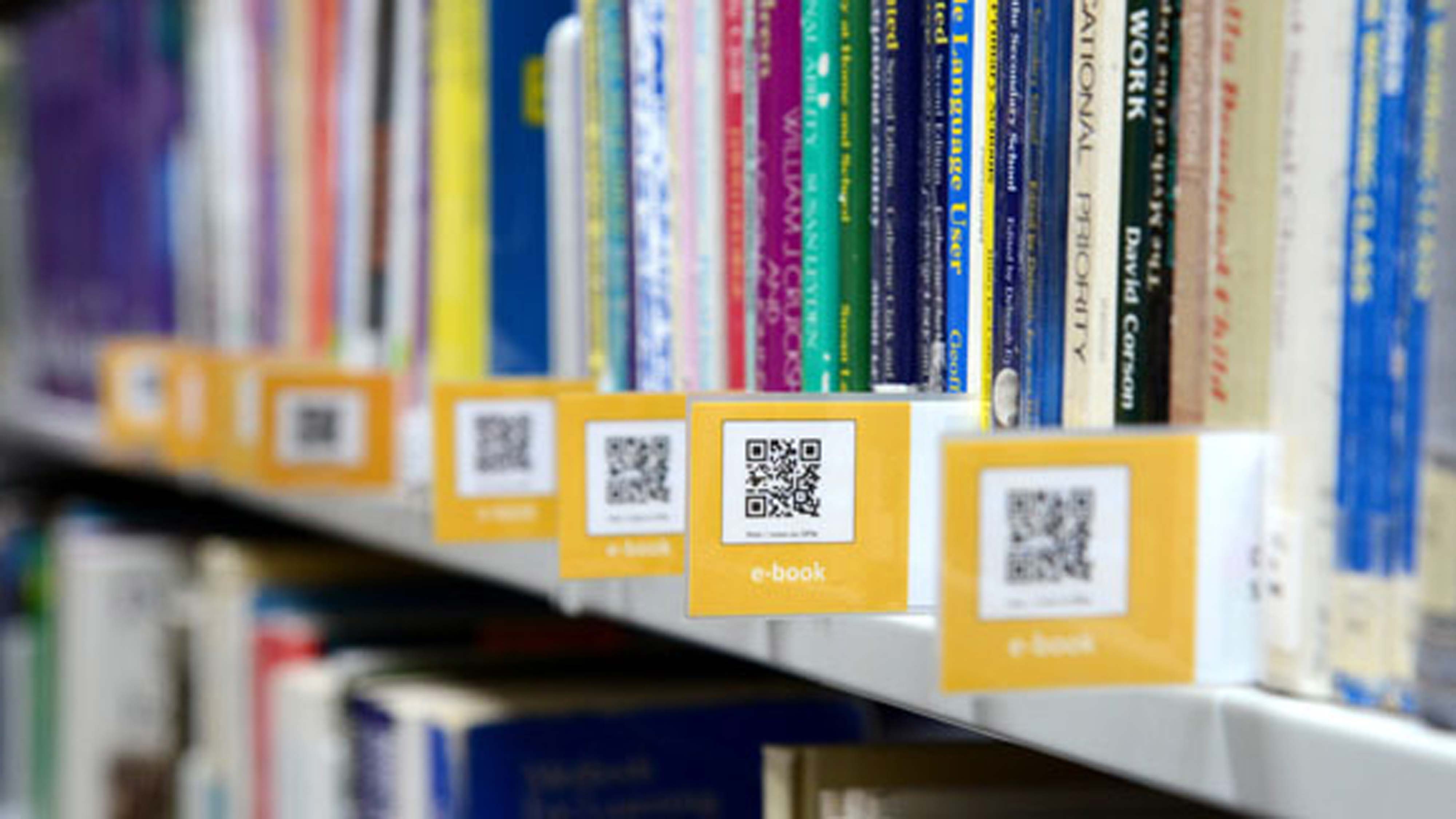 Books on shelves QR codes