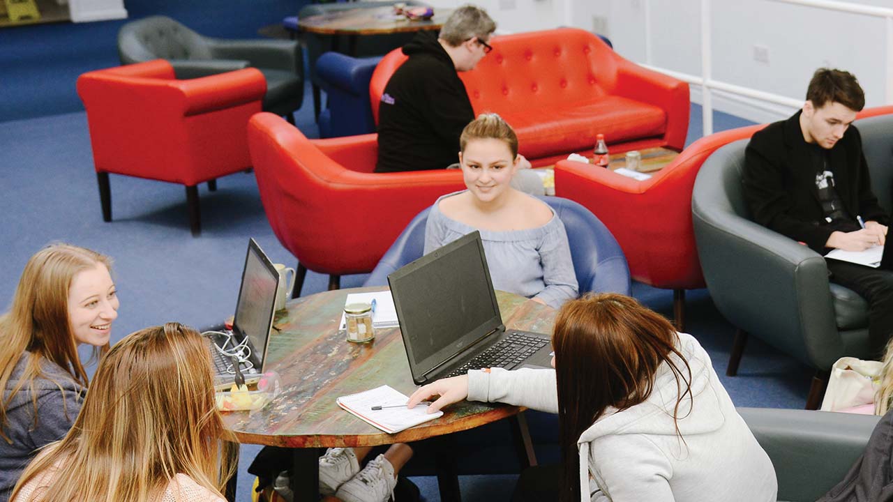 Students working and relaxing in Quad Theatre Cafe