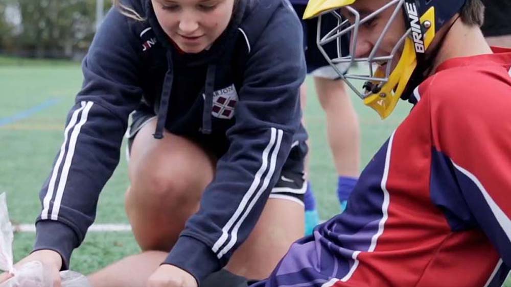 Player receives treatment for an injury on the pitch