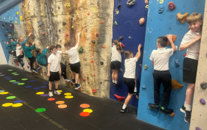 group of school children on a climbing wall