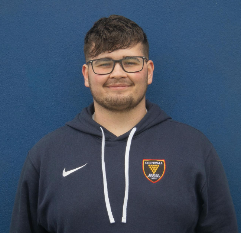 Student smiling in blue hoody