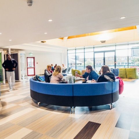 Students on the sofa in the Hub